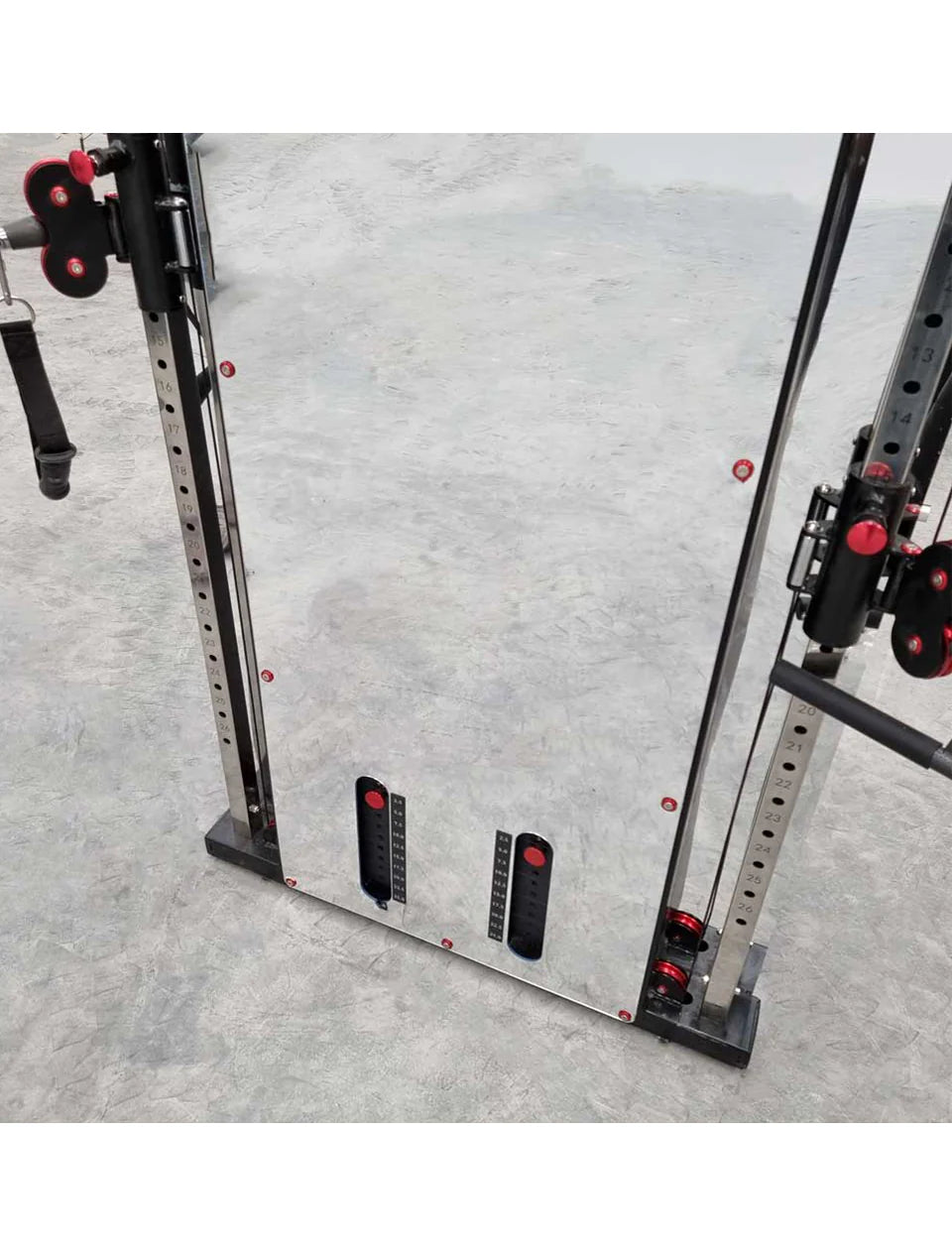 Gym equipment with weight plates on a concrete floor