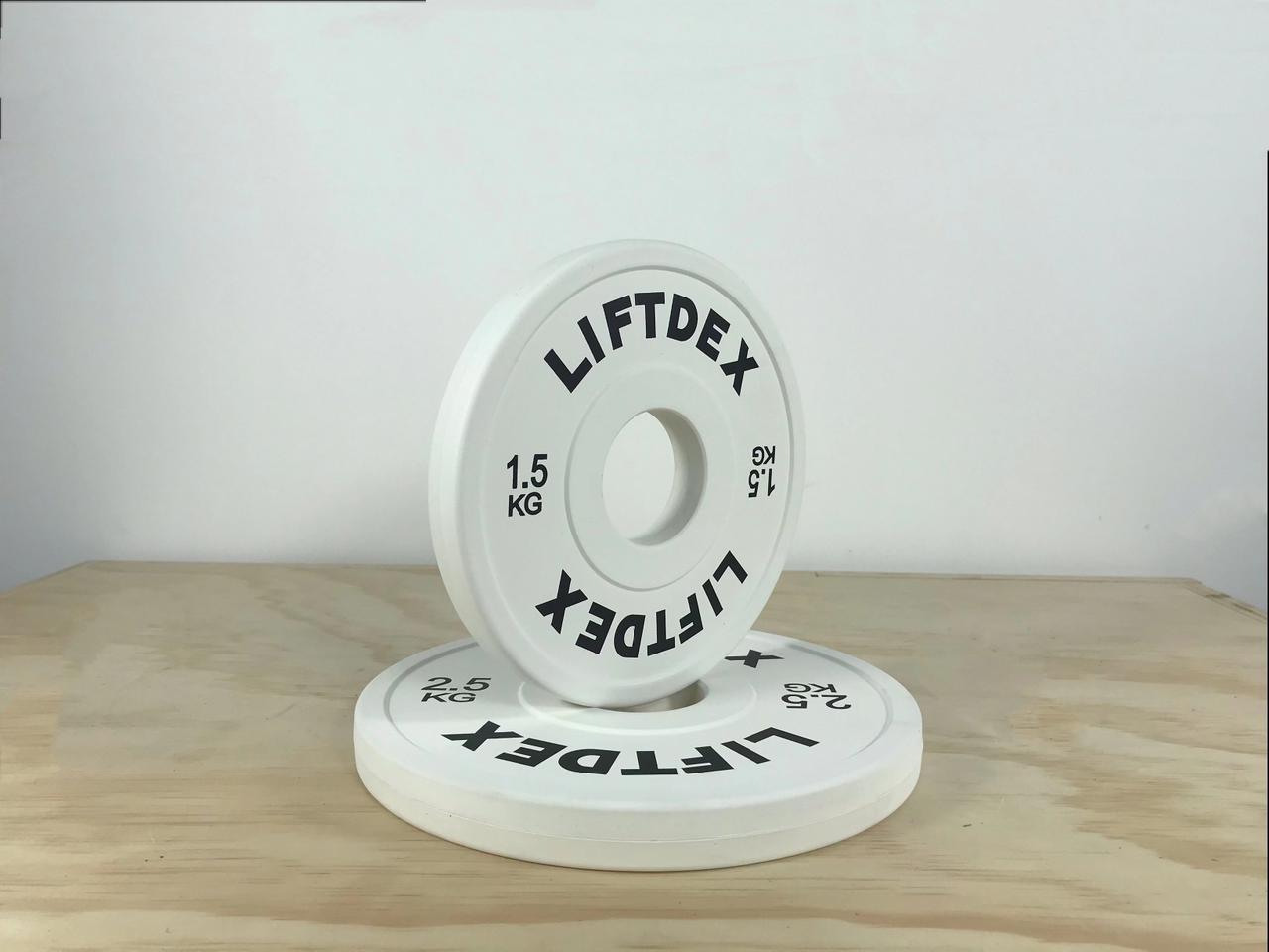 Liftdex 1.5kg fractional change plate – white rubber Olympic micro plate stacked with 2.5kg on gym floor, ideal for breaking plateaus