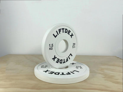 Liftdex 1.5kg fractional change plate – white rubber Olympic micro plate stacked with 2.5kg on gym floor, ideal for breaking plateaus