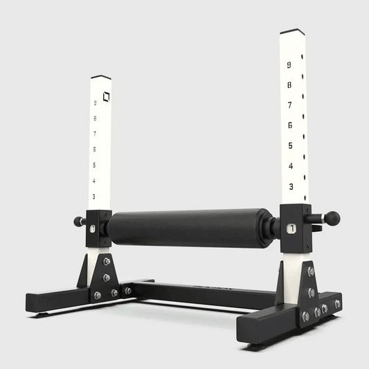 Black and white exercise equipment with measurement scales on a light gray background