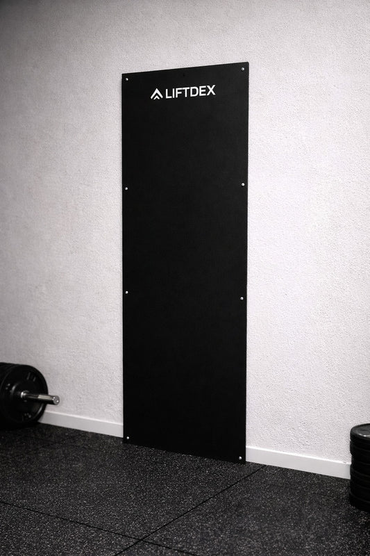 Black wall plate with 'LIFTDEX' branding against a gray wall.