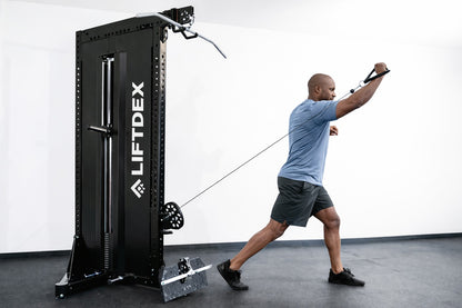 Person using a LIFTDEX pull-up machine in a gym setting