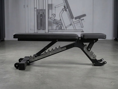 A black adjustable weight bench with a padded seat and backrest, shown in a gym setting with a concrete floor and a large instructional wall graphic in the background.