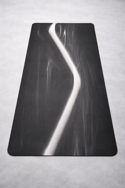 Black and white abstract art on a textured gray surface